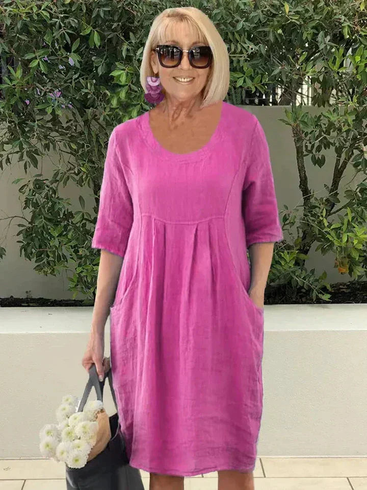 Versatile women's comfortable dress, a loose fit flowy design with essential side pockets.