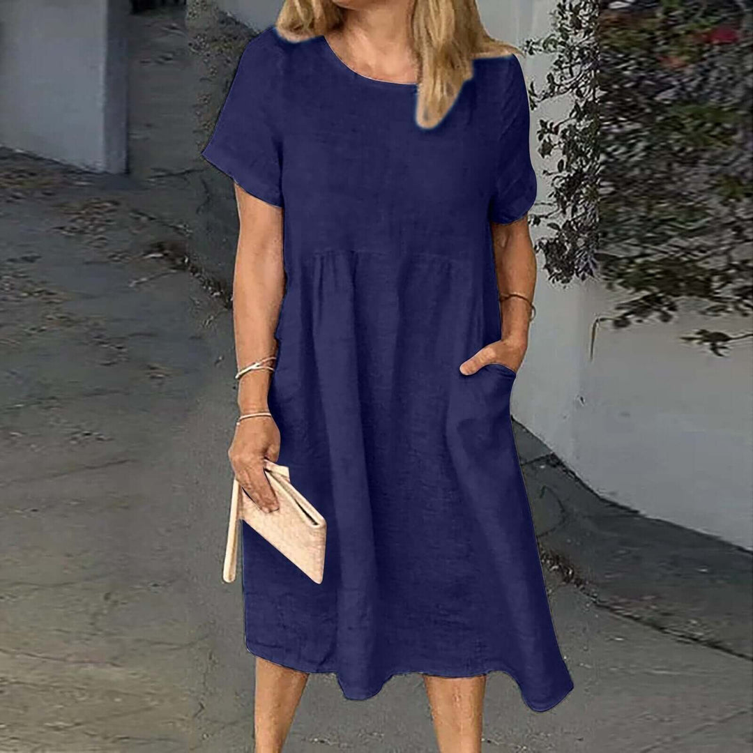 Women's loose fit midi dress in breathable fabric, perfect for all-day comfort & casual everyday wear.