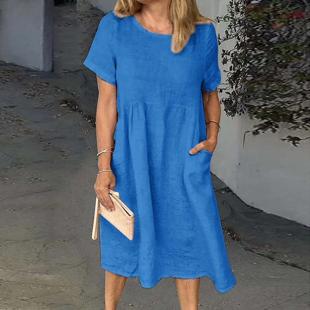 Stylish women's relaxed fit midi dress. Versatile for summer fashion, offering comfort & a chic casual look.