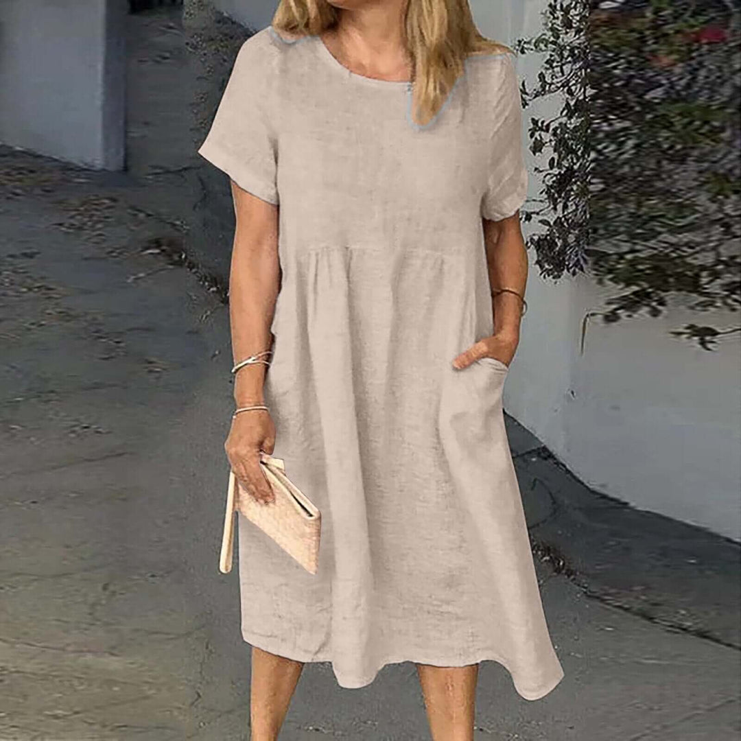 Comfortable women's loose fit midi dress, ideal for relaxed everyday wear or stylish summer outings. Breathable design.