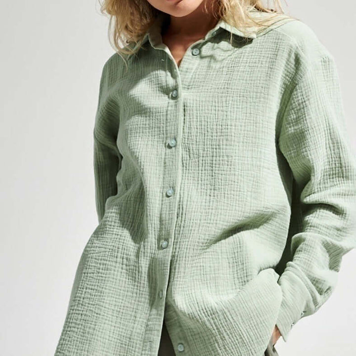 Women's loose long sleeve polo shirt, perfect for casual, comfortable everyday wear.