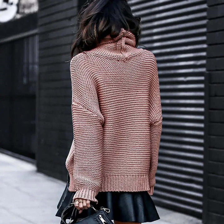 Stylish women's loose-fit roll neck turtleneck sweater, a comfortable and chic choice for casual wear.