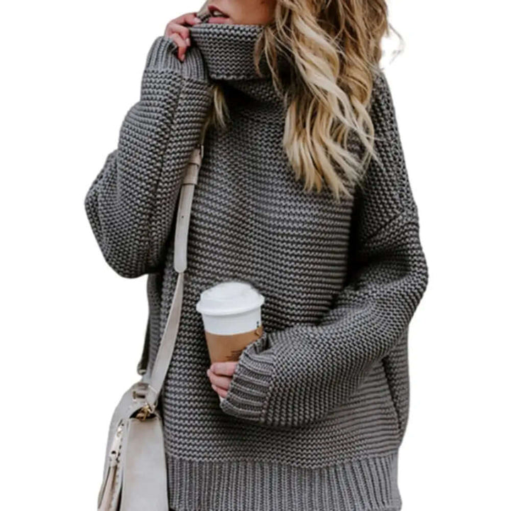 Versatile women's loose roll neck sweater, a cozy acrylic turtleneck top for effortless fall/winter style.