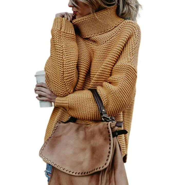 Women's stylish loose roll neck sweater. Cozy acrylic turtleneck pullover for fall and winter comfort.