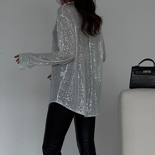 Shimmering women's loose sequin blouse, designed for party wear; a glamorous top with sparkle for evenings.