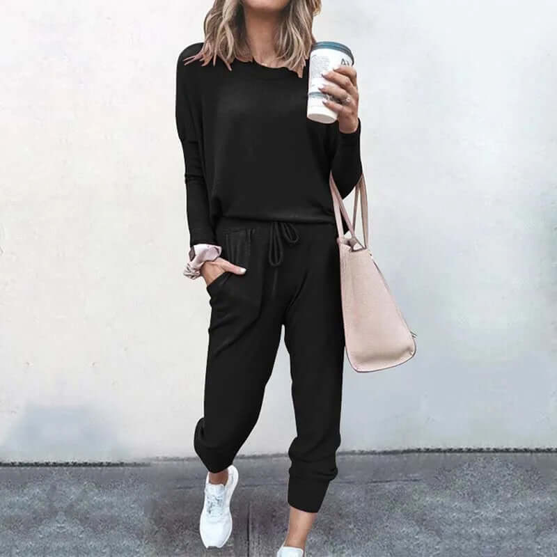 Relaxed fit women's two-piece casual wear, a chic and comfy pullover and jogger set.