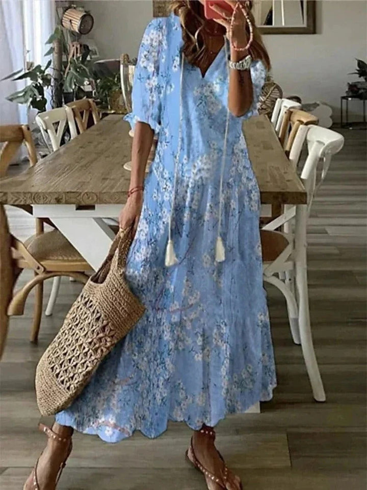 Flowy Luna Long Boho Maxi Dress for women, elegant leaf & stripe pattern. Ideal spring/summer vacation wear.