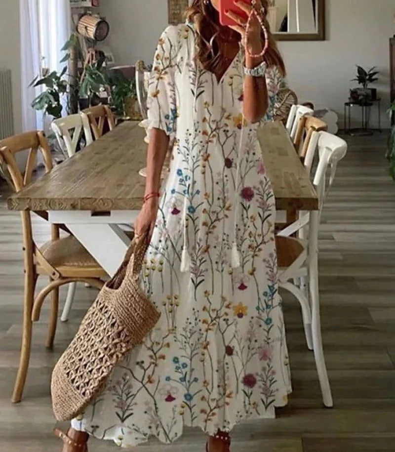 Bohemian A-line long dress, women's Luna style, intricate leaf & stripe pattern, V-neck. Casual elegance.