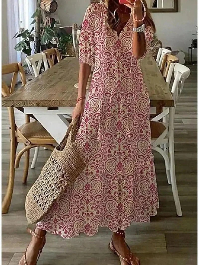Chic women's long bohemian dress, Luna style, featuring a stylish leaf & stripe pattern. V-neck, half sleeves.
