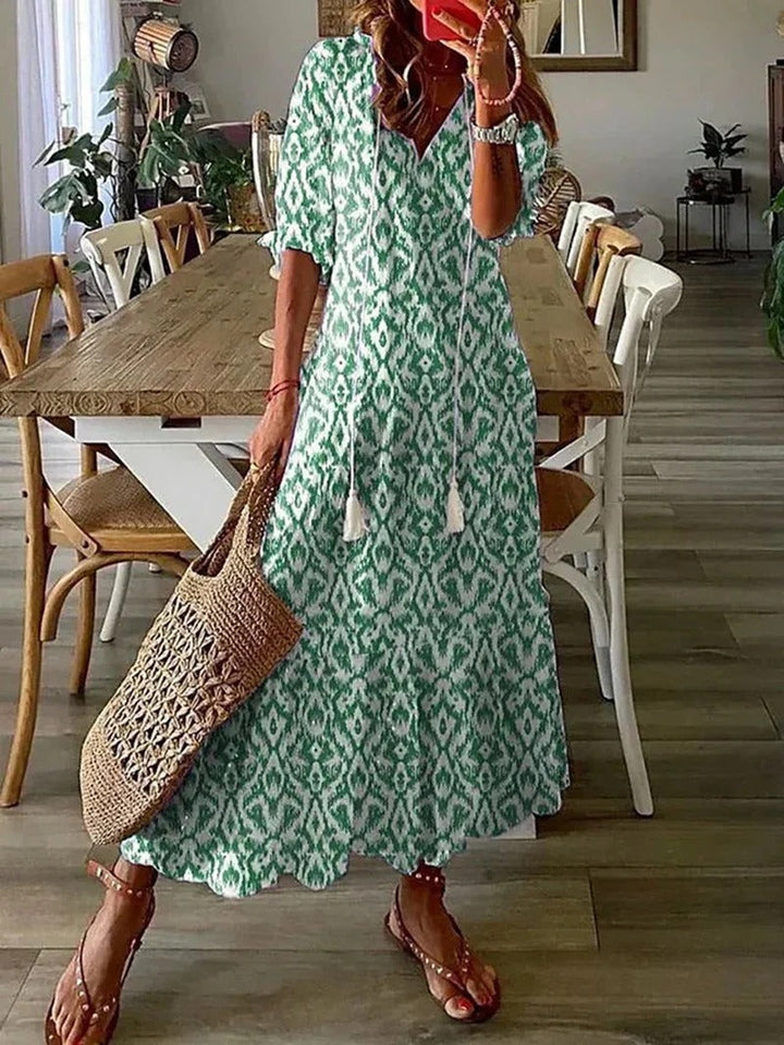 Women's Luna Long Boho Maxi Dress with distinctive leaf & stripe pattern. V-neck, half-sleeve, A-line cut.