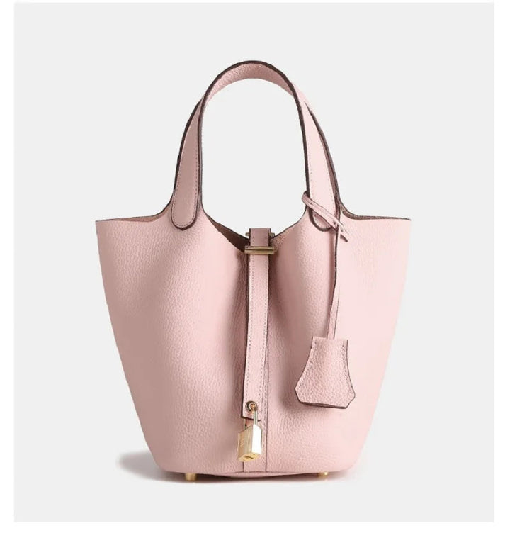 Versatile women's leather bucket bag, perfect neutral accessory to elevate any modern ensemble.