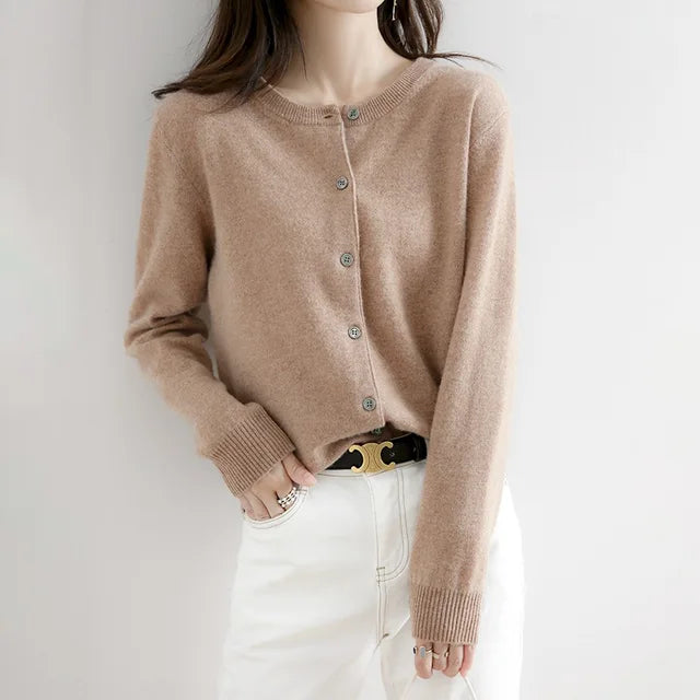 Cozy women's button-front cashmere sweater. Ultra-soft knitwear for comfortable warmth and style.