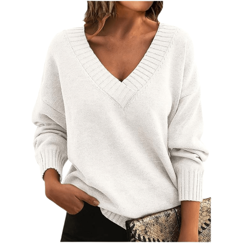 Relaxed woman in a cozy V-neck cashmere sweater, perfect for elegant comfort & warmth.