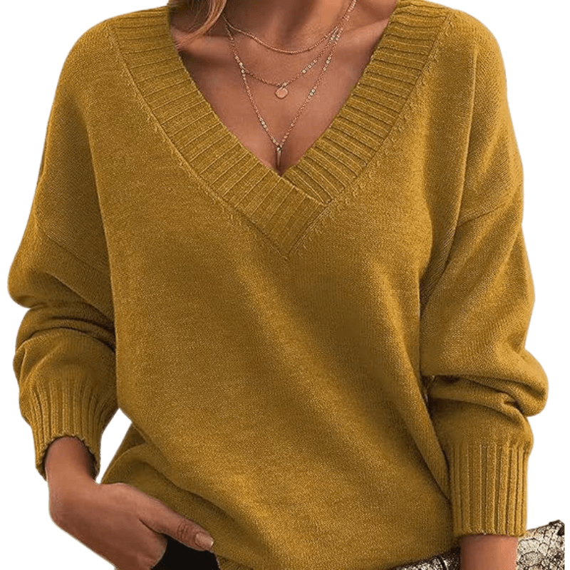 Close-up of soft women's V-neck cashmere sweater texture, premium luxury knit detail.