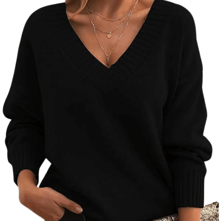 Woman models a luxurious V-neck cashmere sweater, elegant & cozy winter wear. Soft pullover.