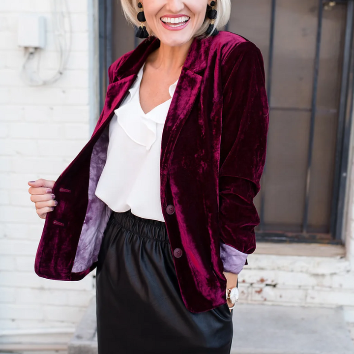 Women's luxurious velvet blazer jacket. Elegant long sleeve formal wear. Chic office attire outerwear.