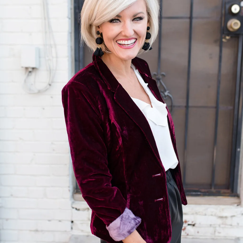 Chic long sleeve dark green velvet blazer for women. Stylish jacket for office or party attire.