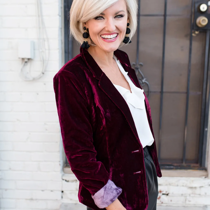 Chic long sleeve dark green velvet blazer for women. Stylish jacket for office or party attire.