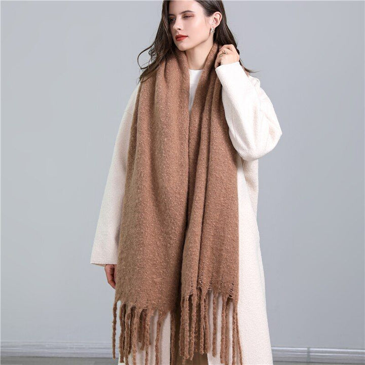 Soft women's cashmere plaid scarf, a comfortable and warm winter fashion essential.