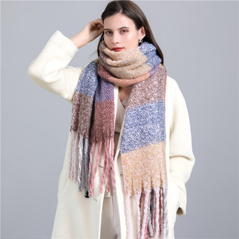 Stylish women's Carmie checked luxury cashmere scarf, a warm and essential winter accessory.