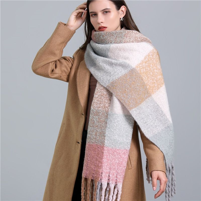 Soft women's luxury cashmere scarf in a checked pattern, perfect for chilly winter days.