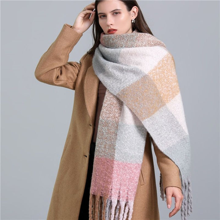 Soft women's luxury cashmere scarf in a checked pattern, perfect for chilly winter days.