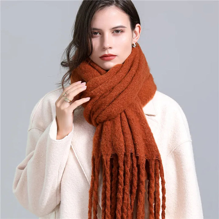 Stylish women's plaid cashmere scarf, perfect for cold weather and winter fashion.