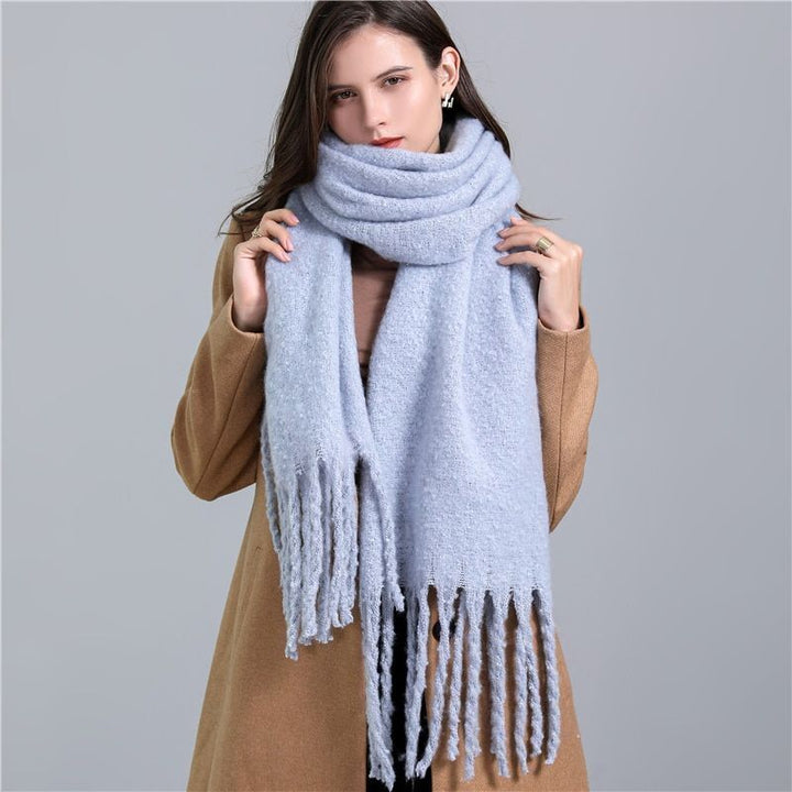 Women's luxury cashmere checked scarf, perfect for adding warmth and style to winter outfits.