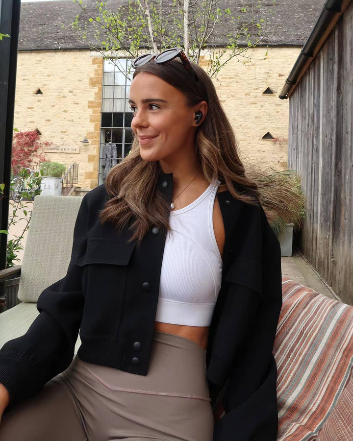 Fall/Winter women's cropped bomber jacket. Stylish outerwear for layering and urban casual wear.