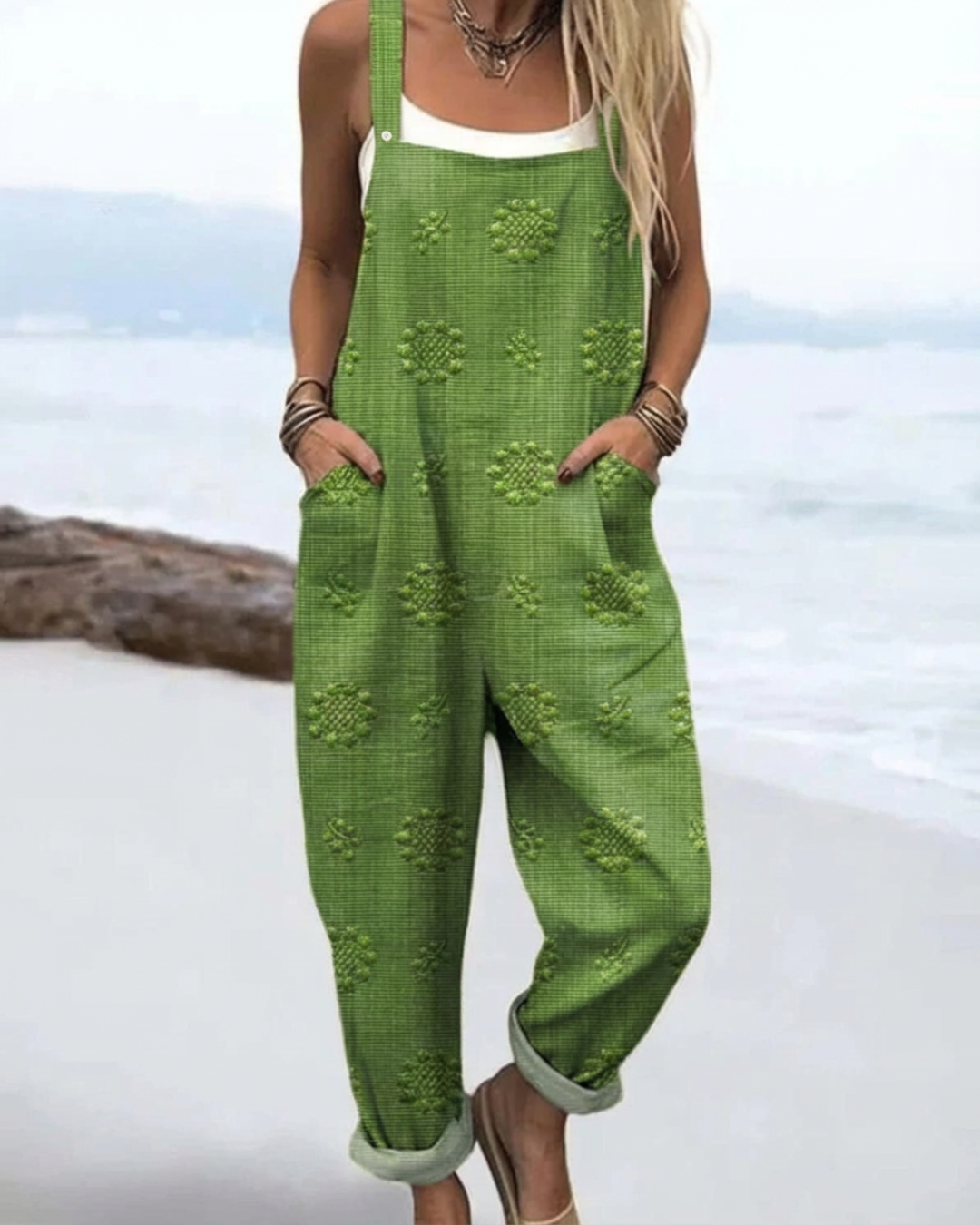 Chic women's floral jumpsuit with a relaxed wide-leg fit, ideal for versatile one-piece summer fashion & effortless style.