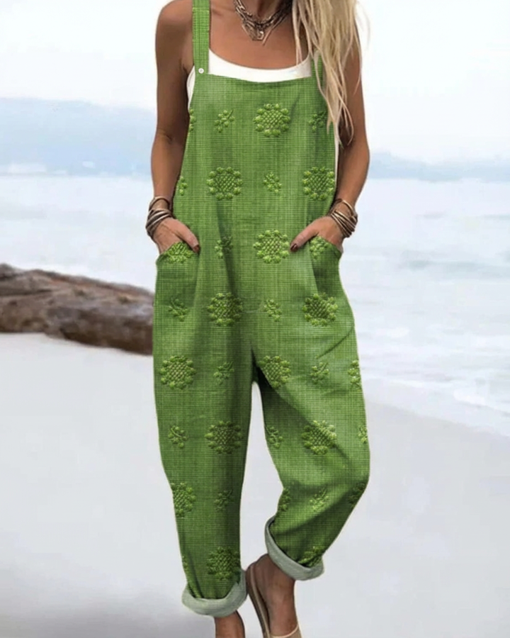 Chic women's floral jumpsuit with a relaxed wide-leg fit, ideal for versatile one-piece summer fashion & effortless style.