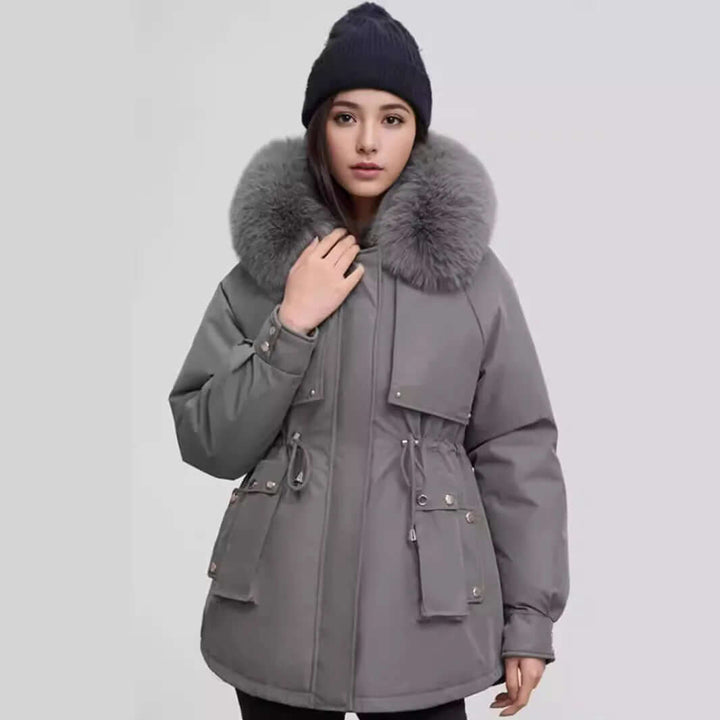 Women's warm winter coat with a stylish faux fur collar. Mid-length polyester jacket for elegant ladies.