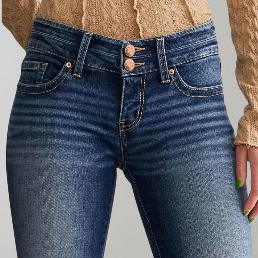 Classic blue stretch denim women's mid-waist jeans with a stylish slim fit and flared leg.