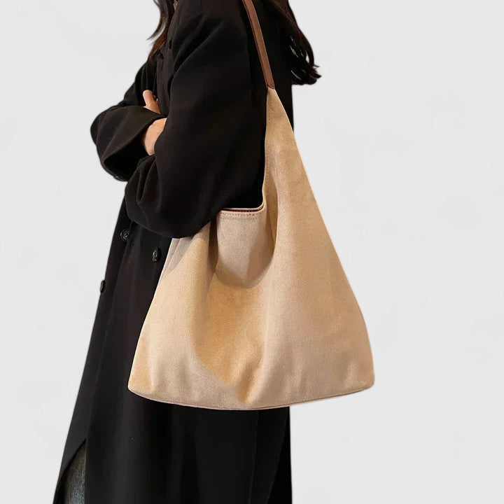 Versatile women's shoulder bag, minimalist design, essential everyday accessory for modern fashion.