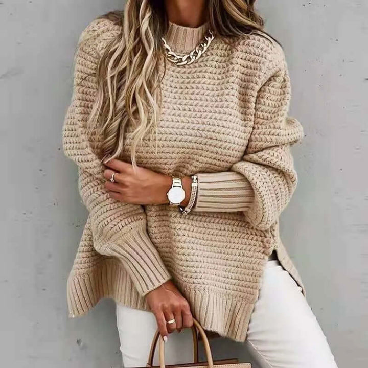 Woman wearing a stylish mock neck knitted jumper, showcasing its elegant fit and cozy winter comfort.