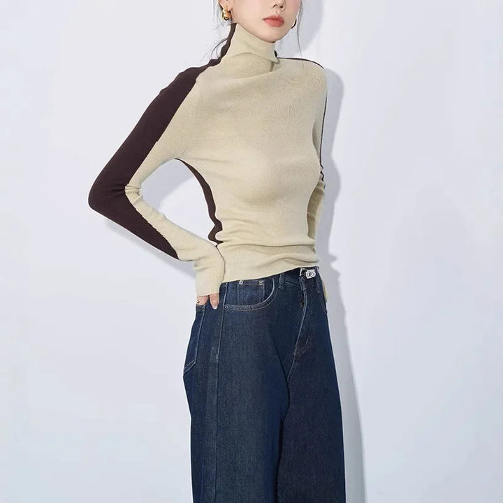 Sophisticated women's mock neck sweater. Modern design with unique contrast long sleeves, ideal for everyday wear.