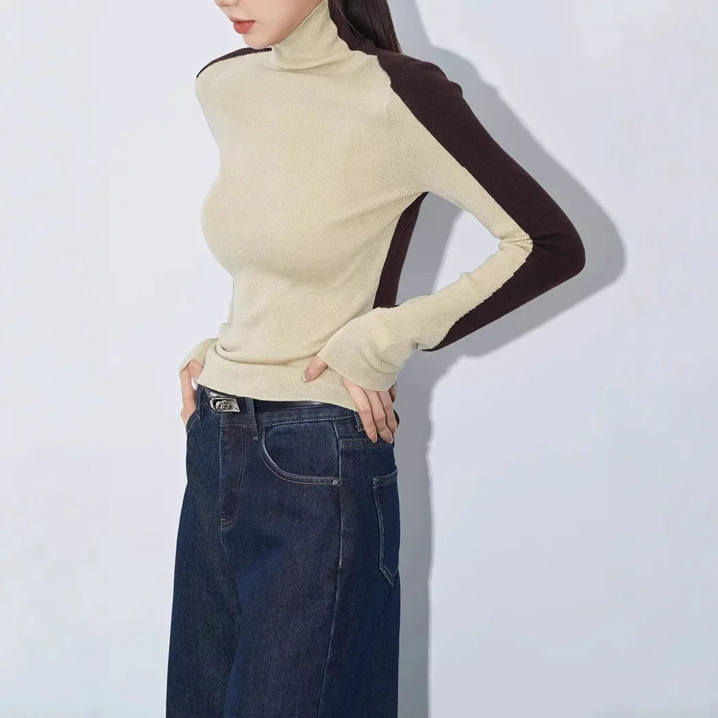 Casual chic women's long sleeve mock neck top. Features stylish contrast sleeves, perfect as a versatile sweater.