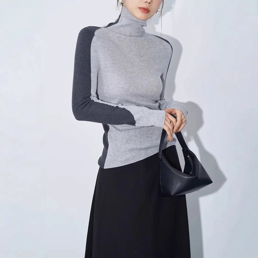 Stylish women's mock neck top. Asymmetric, long contrast sleeves define this versatile sweater, perfect for women.