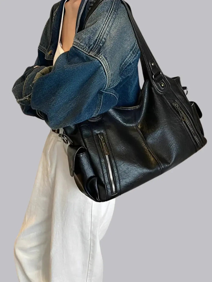 Functional multi-pocket leather shoulder bag for women, keeping belongings organized and accessible.
