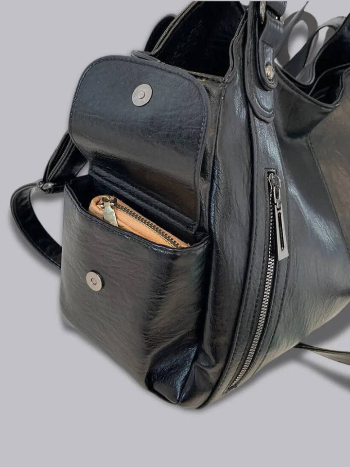 Organized women's leather multi-pocket crossbody bag, a blend of fashion and utility.
