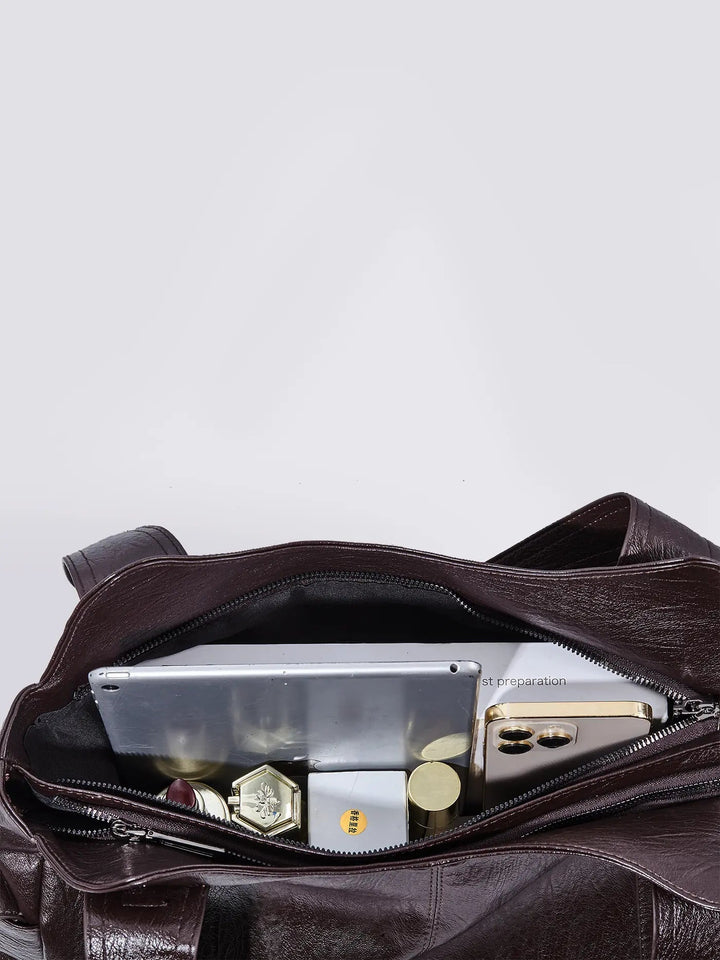 Classic women's multi-pocket leather shoulder bag, a timeless accessory for any wardrobe.