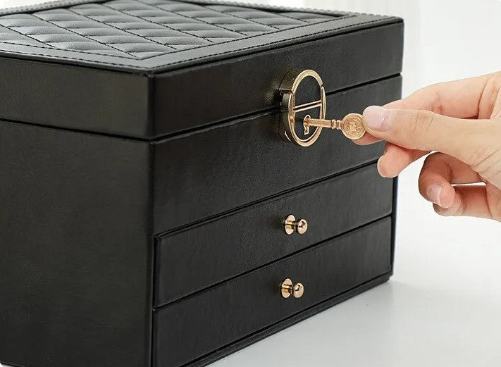 Side view of an elegant women's multilayer leather jewelry storage box, sleek design.