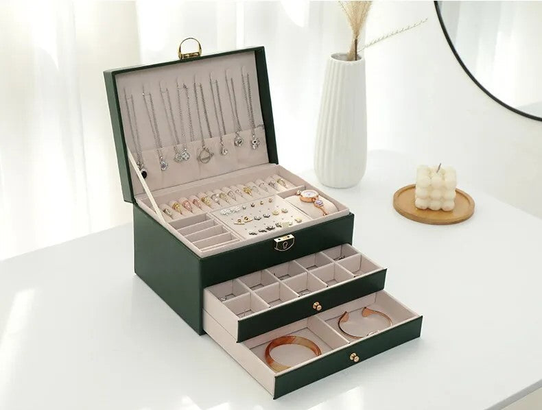 Multilayer jewelry box with dedicated necklace holder hooks & spacious chain storage.