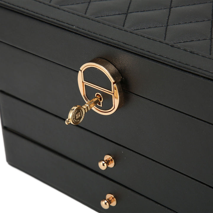 Organized ring storage section in elegant women's multilayer leather jewelry box organizer.