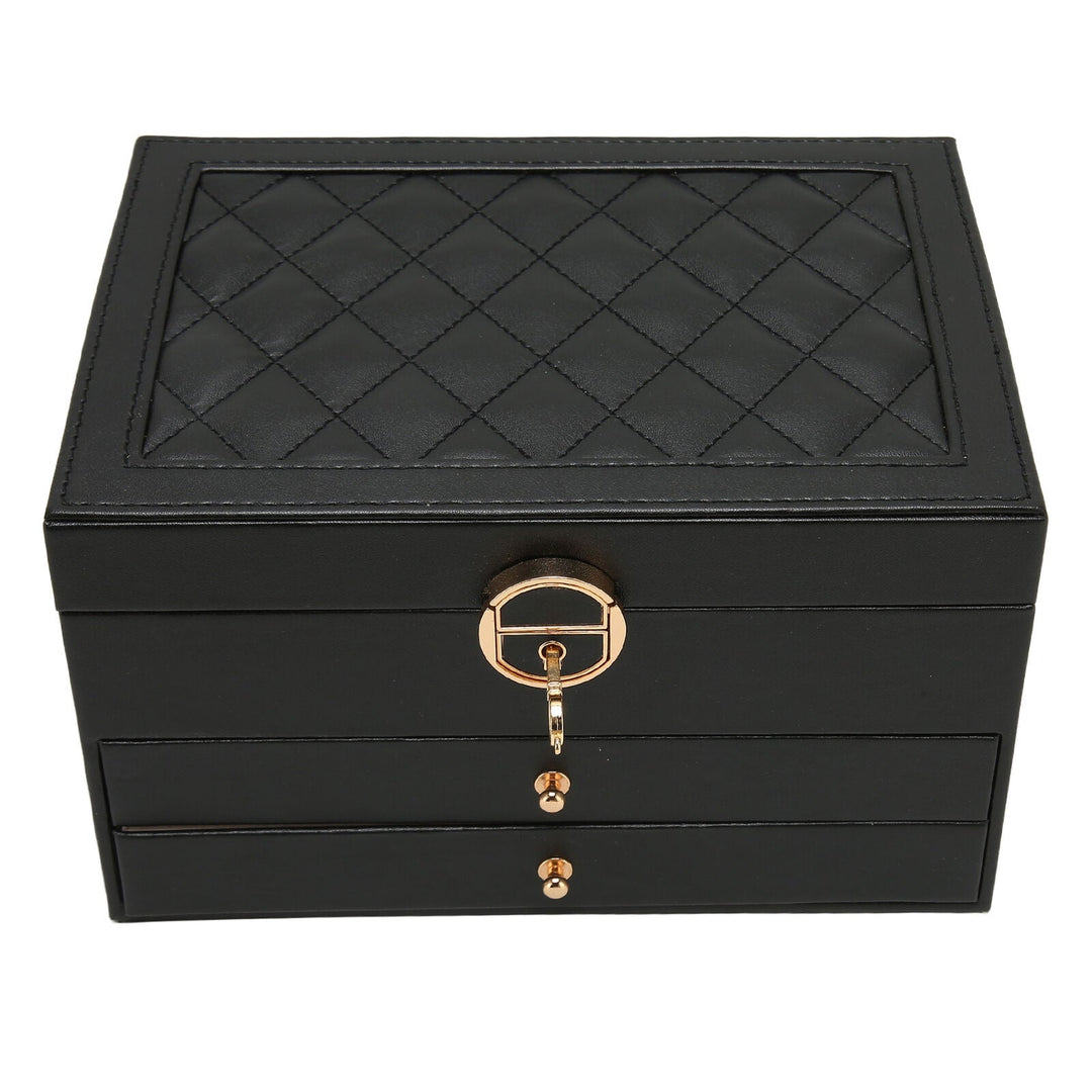 Detailed view of internal compartments in women's premium leather multilayer jewelry box.