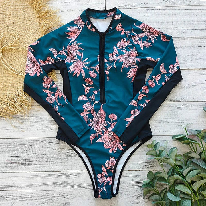 Athletic women's long-sleeve swimsuit, zip front, perfect for water sports & UV sun protection.