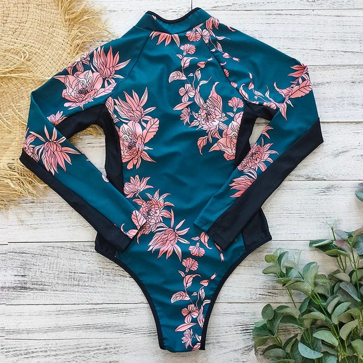 Stylish women's long-sleeve one-piece swimsuit with front zipper, ideal for beach & pool sun protection.