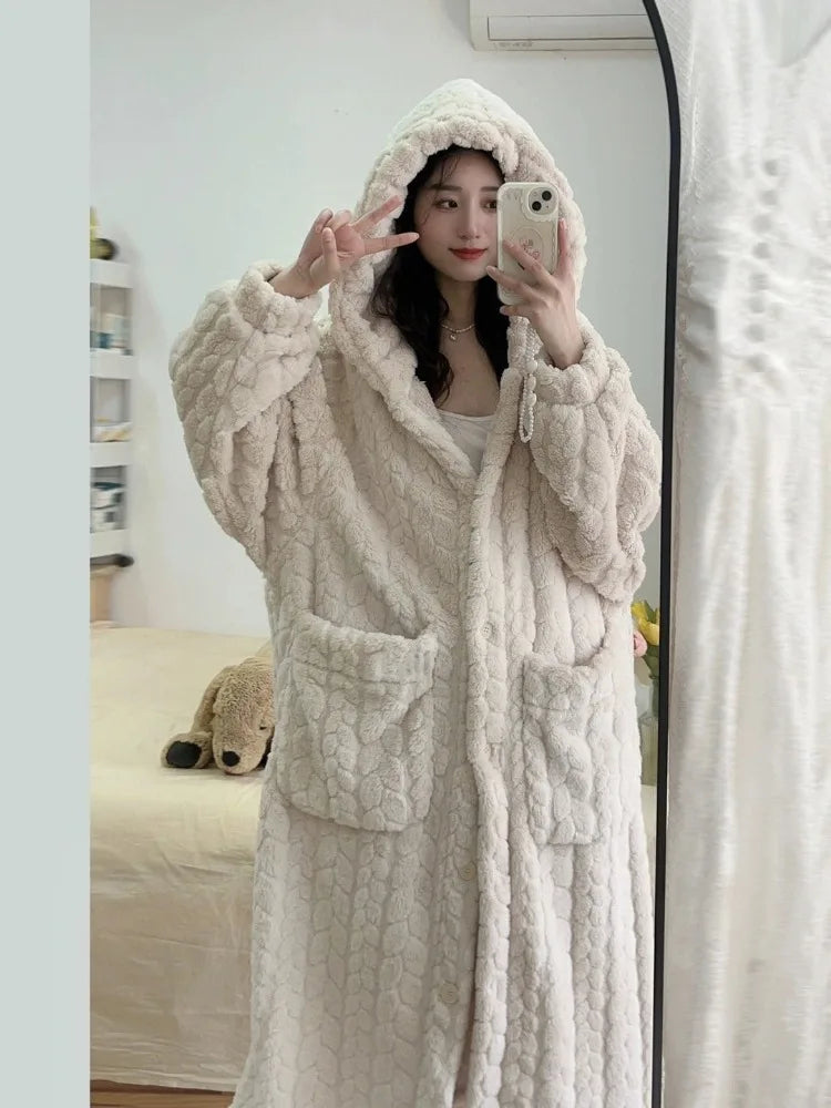 Women's Nightfall cozy hooded bathrobe in white, perfect for winter comfort and relaxation at home.