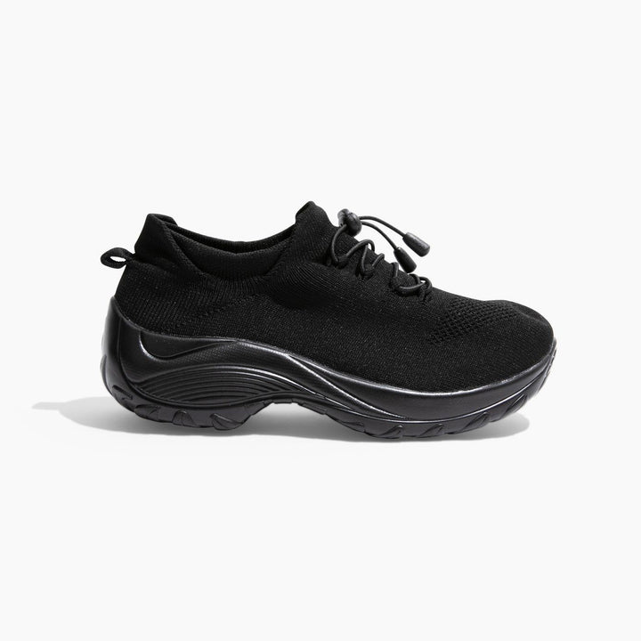 Close-up of women's non-slip healthcare shoe, showing water-resistant knit upper