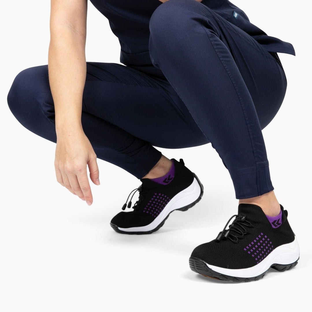 Womens non-slip orthopedic shoe in a hospital setting, practical healthcare footwear